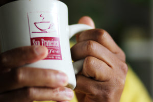 San Francisco Coffee Roasting Co Mug being held