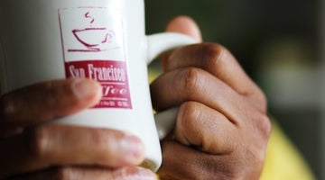San Francisco Coffee Roasting Co Mug being held